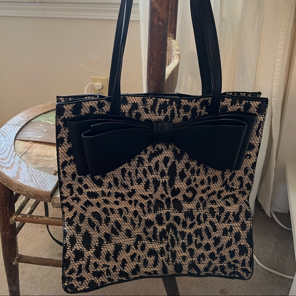 Betsey Johnson leopard tote with black leather straps and giant bow